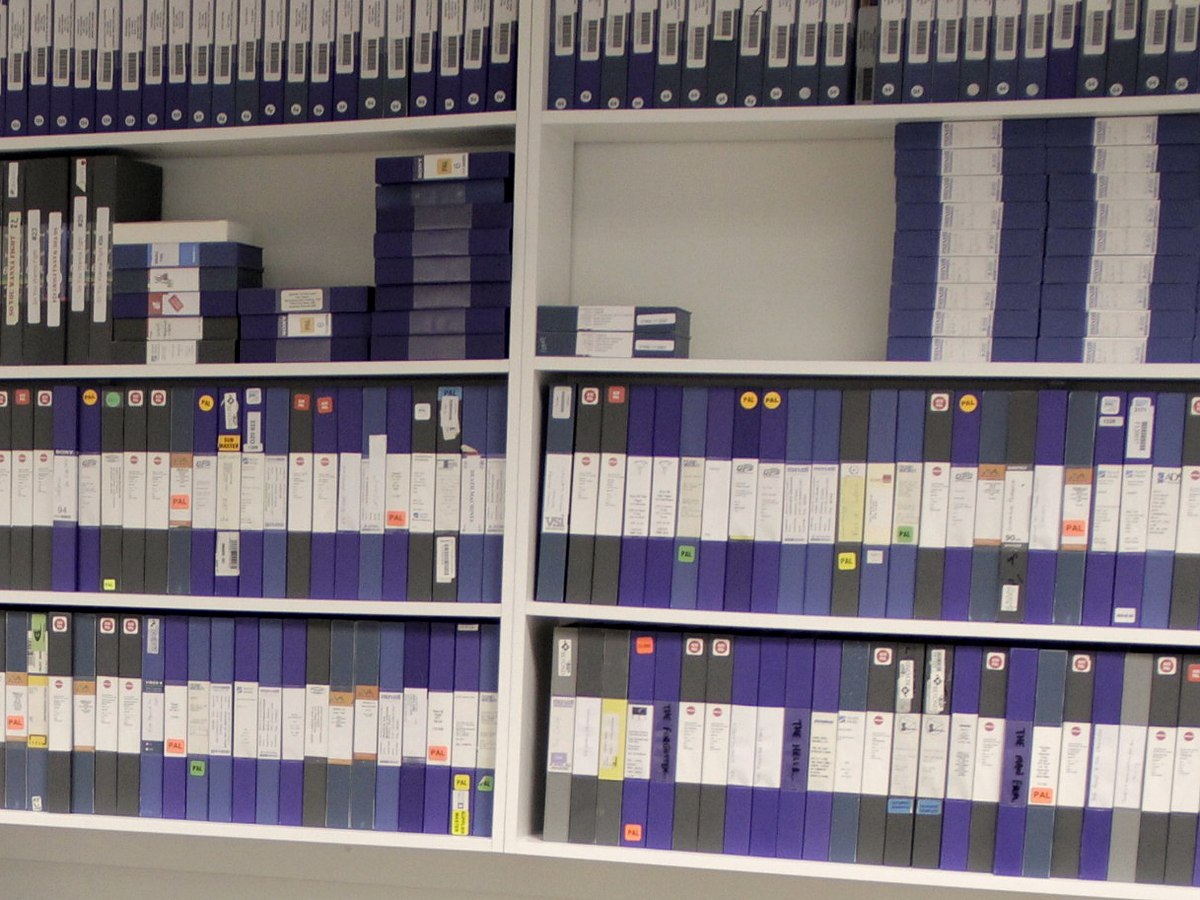 Organised shelves of professional DigiBeta and broadcast videotapes